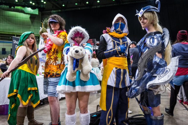 Group of anime cosplayers dressed as their favorite characters at a convention.
